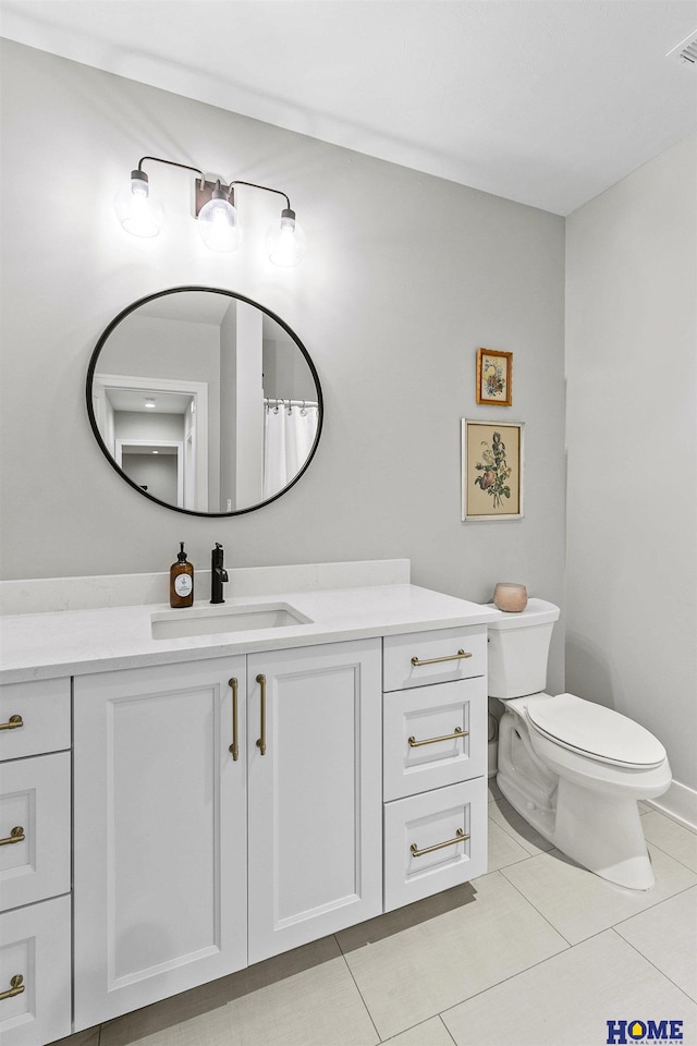 full bathroom with visible vents, vanity, toilet, and tile patterned floors