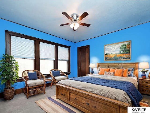 bedroom featuring ceiling fan and light colored carpet