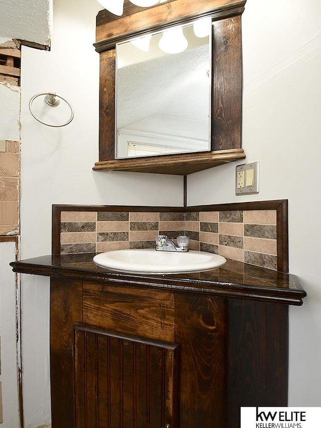 bathroom featuring backsplash and vanity