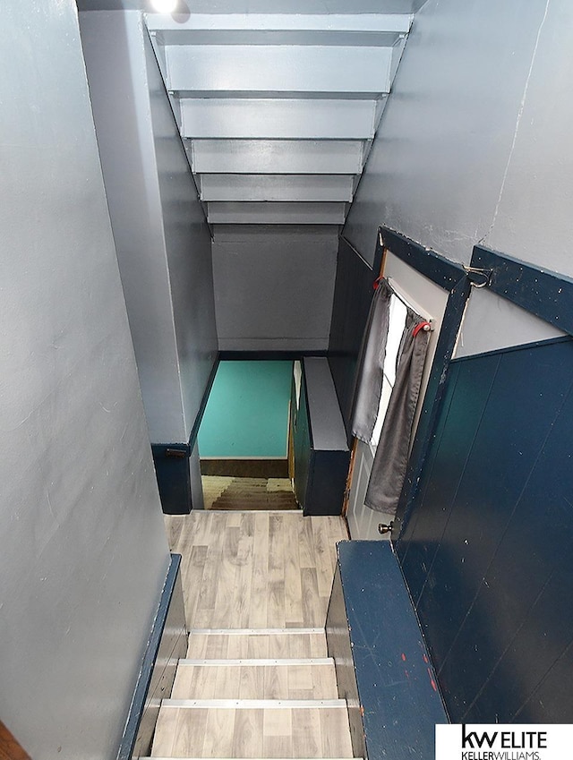 stairway with wood finished floors