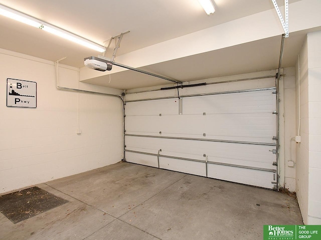 garage featuring a garage door opener