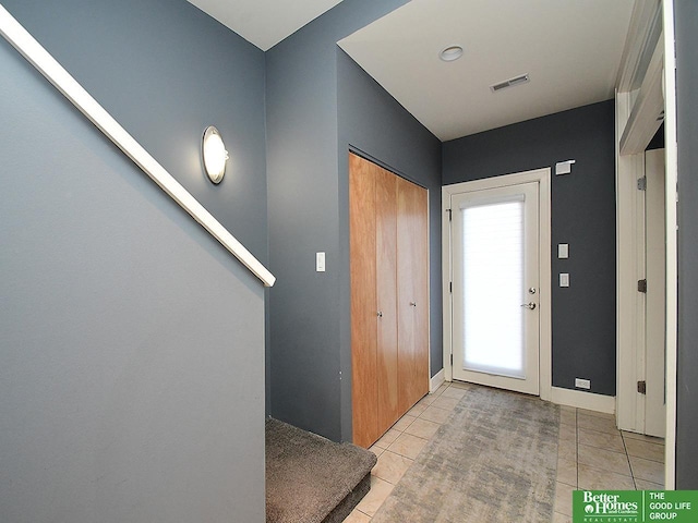 entryway with visible vents and light tile patterned floors