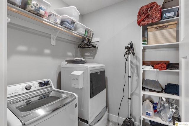 washroom featuring washing machine and dryer and laundry area