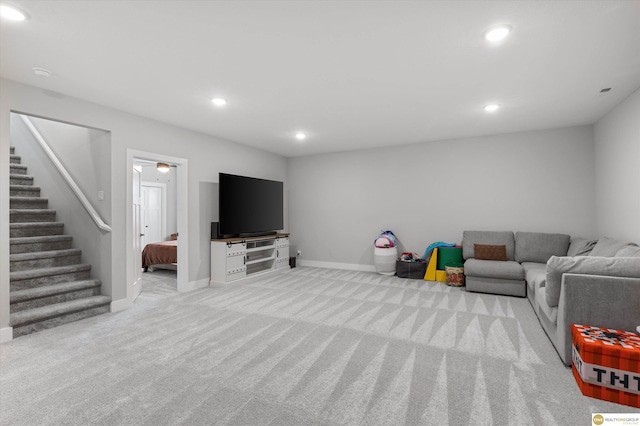 living room with carpet, stairs, baseboards, and recessed lighting