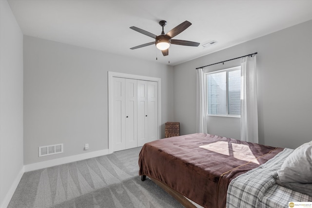 bedroom with carpet floors, baseboards, and visible vents