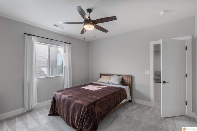 bedroom with light carpet, a ceiling fan, visible vents, and baseboards