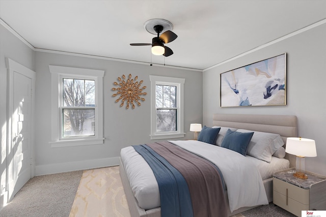 bedroom featuring ornamental molding, carpet, ceiling fan, and baseboards