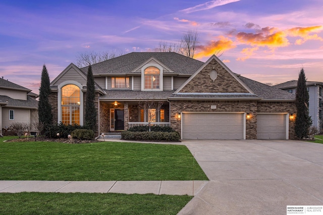 view of front facade featuring a porch, a garage, brick siding, concrete driveway, and a front lawn