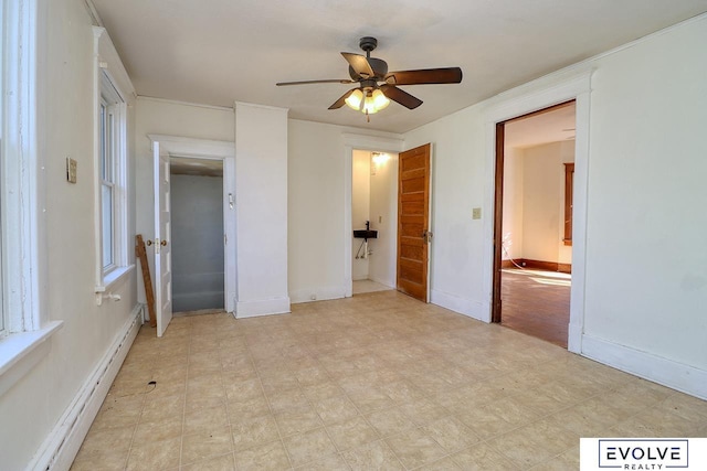 unfurnished bedroom with light floors, baseboards, baseboard heating, and a ceiling fan