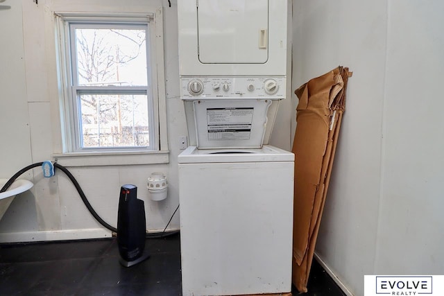 laundry room with laundry area and stacked washing maching and dryer