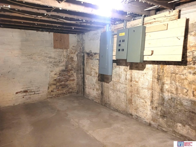 unfinished below grade area with electric panel