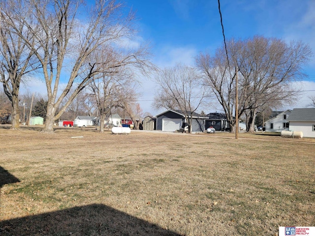 view of yard featuring a garage