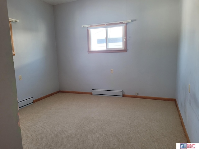 unfurnished room with baseboards, a baseboard heating unit, baseboard heating, and carpet flooring