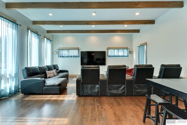 living area with beamed ceiling, recessed lighting, and wood finished floors