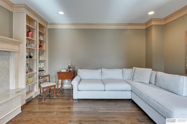 living room with recessed lighting, wood finished floors, and ornamental molding