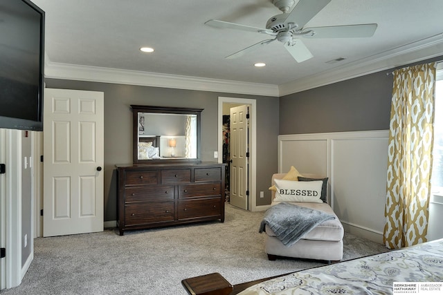 bedroom featuring ceiling fan, visible vents, light colored carpet, and ornamental molding