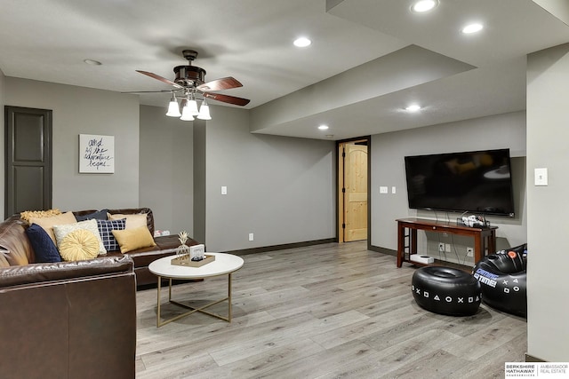 living room with a ceiling fan, recessed lighting, baseboards, and light wood finished floors