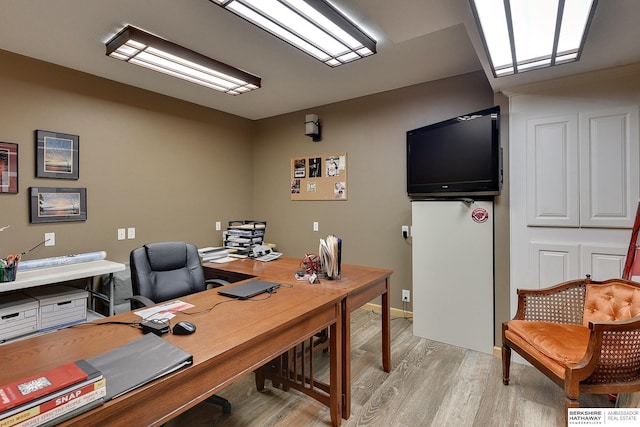 office space with light wood finished floors