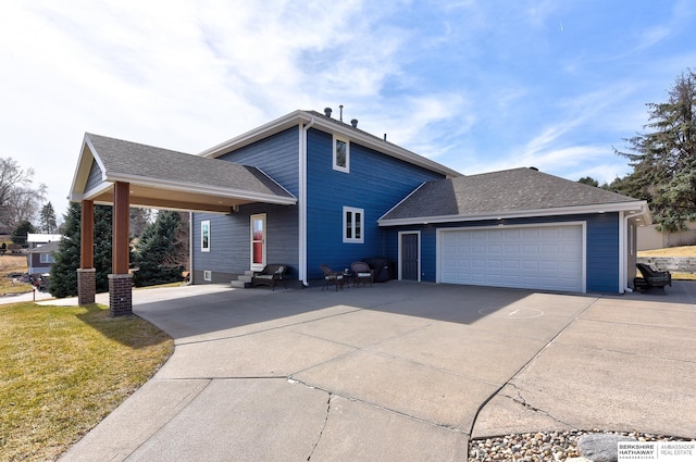 exterior space with driveway, a garage, and roof with shingles