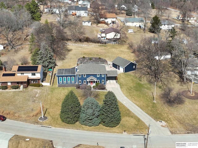 birds eye view of property with a residential view