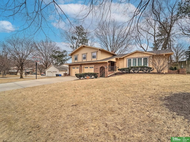 view of front facade featuring an attached garage, concrete driveway, brick siding, and a front yard