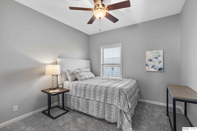 carpeted bedroom with ceiling fan and baseboards