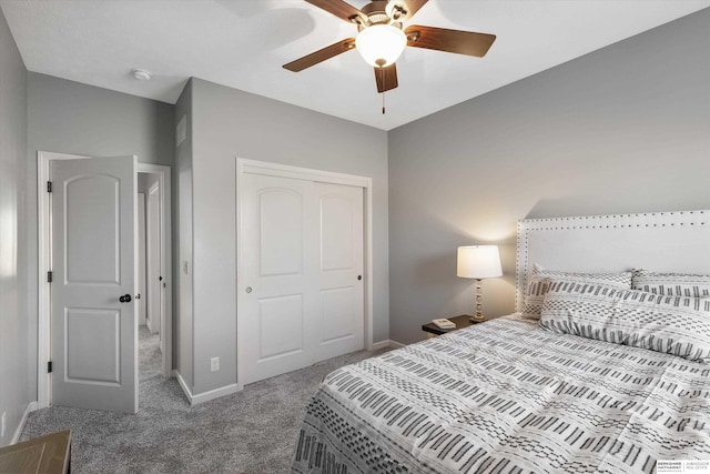 bedroom featuring a ceiling fan, a closet, carpet flooring, and baseboards