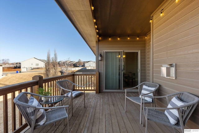 wooden deck featuring a residential view