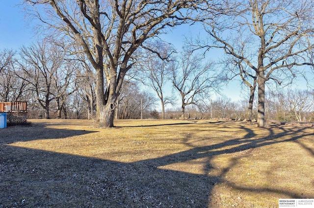 view of yard with a wooden deck