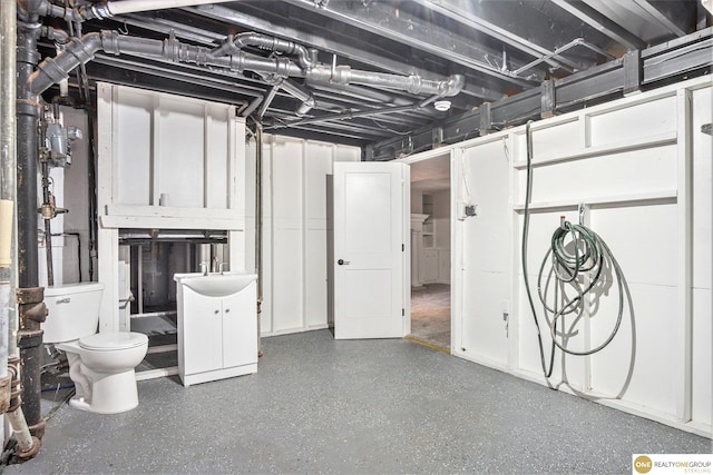 unfinished basement featuring a sink