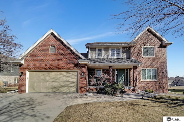 traditional-style house featuring driveway, covered porch, an attached garage, and brick siding