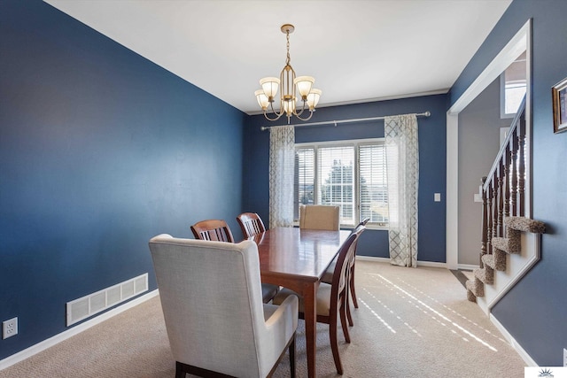 dining area featuring carpet floors, visible vents, stairway, an inviting chandelier, and baseboards