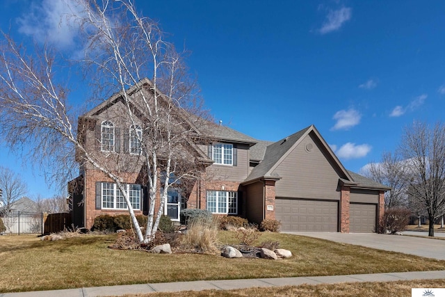 traditional-style house with an attached garage, brick siding, a front yard, and fence