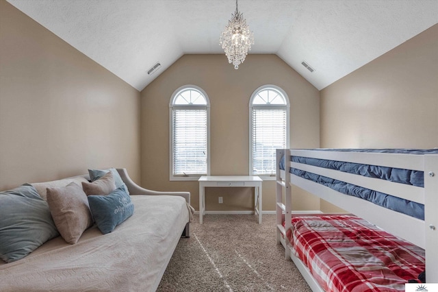 bedroom featuring vaulted ceiling, a textured ceiling, carpet flooring, and visible vents