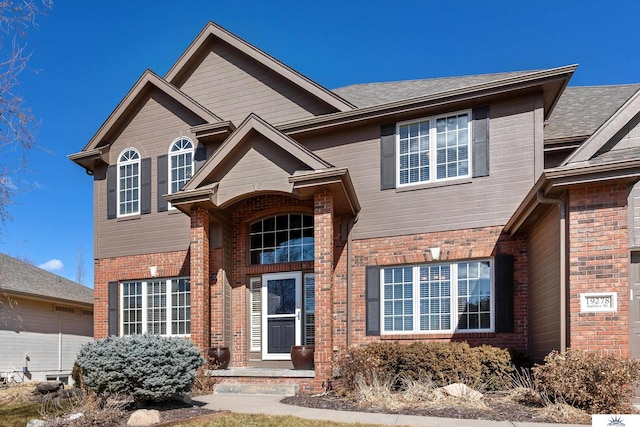 traditional home with brick siding