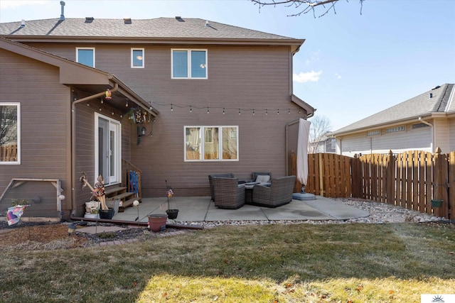 rear view of house with entry steps, a patio, an outdoor hangout area, fence, and a lawn