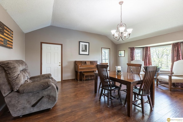 dining space featuring an inviting chandelier, a textured ceiling, vaulted ceiling, and dark wood-type flooring