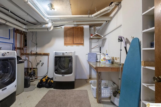 laundry area featuring laundry area and washer / dryer