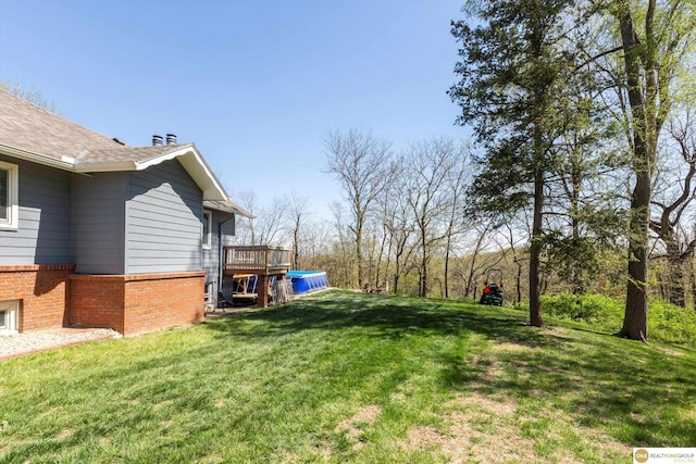 view of yard featuring a wooden deck