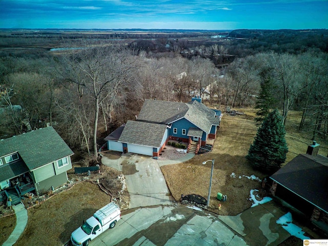 bird's eye view featuring a forest view