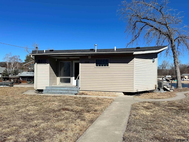 back of house featuring central AC