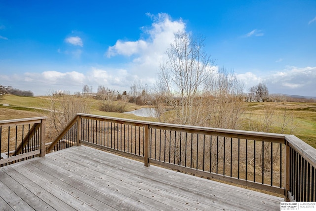 wooden terrace with a water view