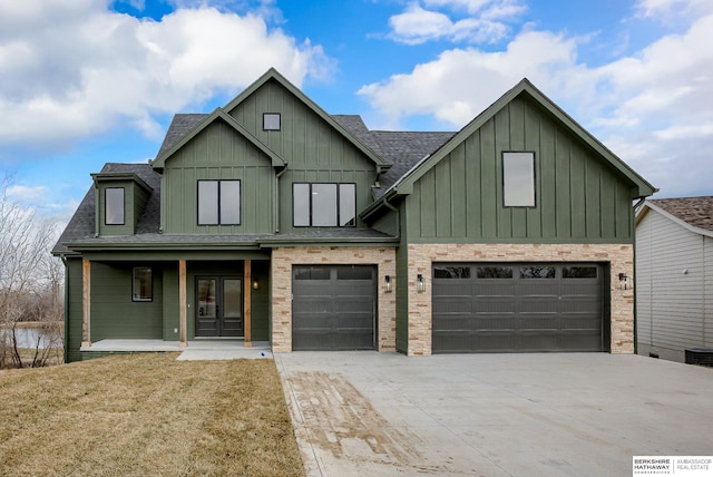 view of front of house featuring a garage, a shingled roof, concrete driveway, a porch, and board and batten siding