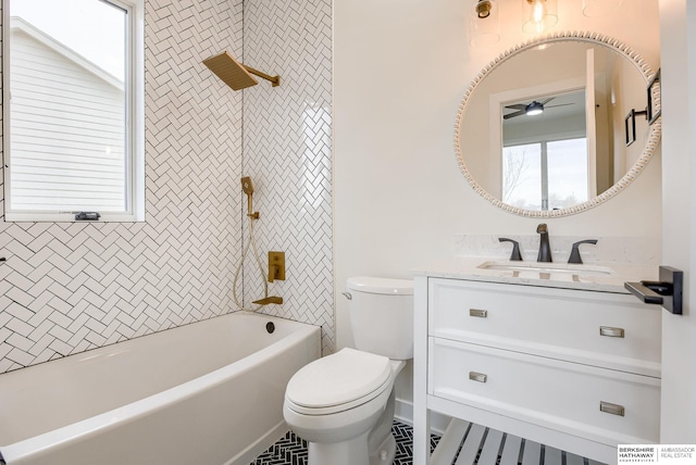 bathroom with toilet, shower / bathtub combination, ceiling fan, and vanity