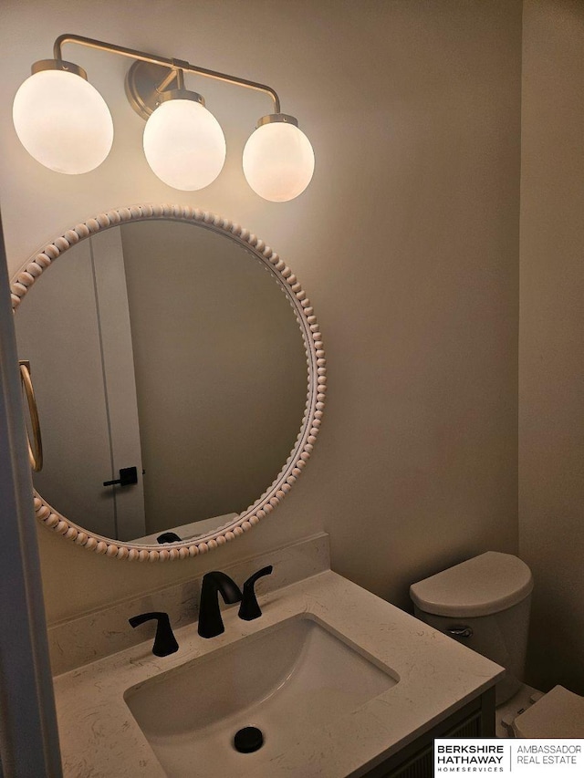 half bath with toilet and vanity