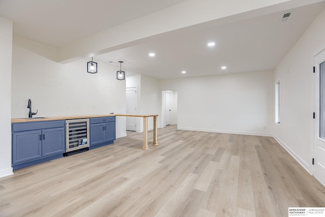 bar with wine cooler, recessed lighting, visible vents, light wood-style floors, and a sink