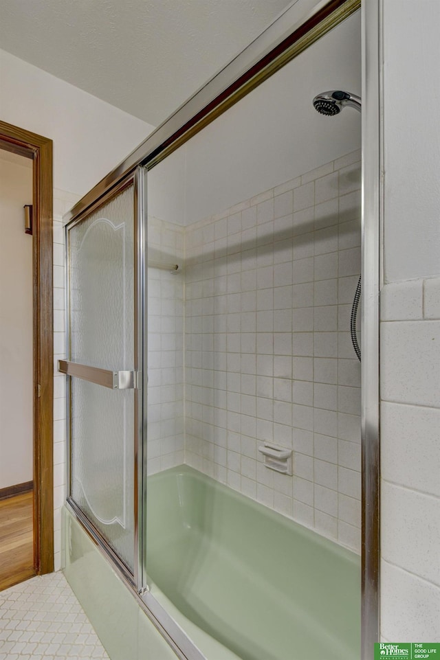 bathroom featuring enclosed tub / shower combo