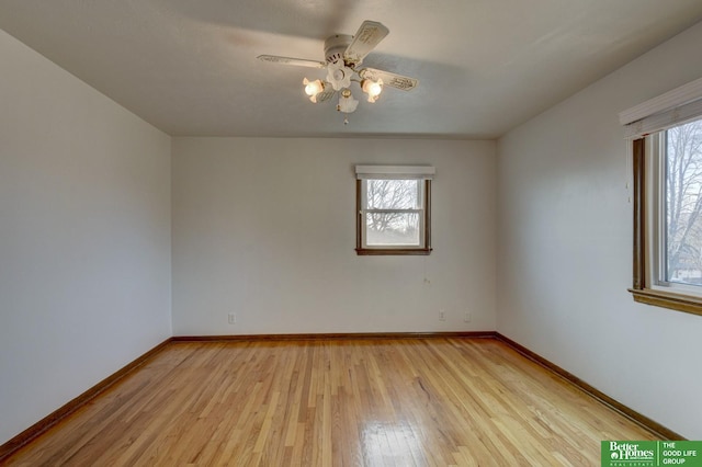 unfurnished room with light wood-style flooring, baseboards, and ceiling fan