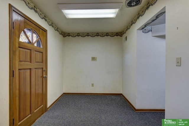 carpeted entrance foyer featuring baseboards and visible vents