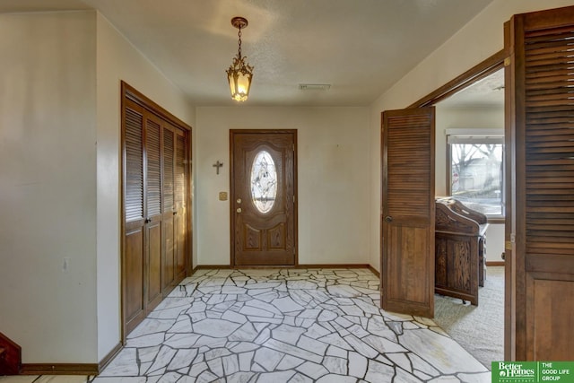 entrance foyer featuring visible vents and baseboards